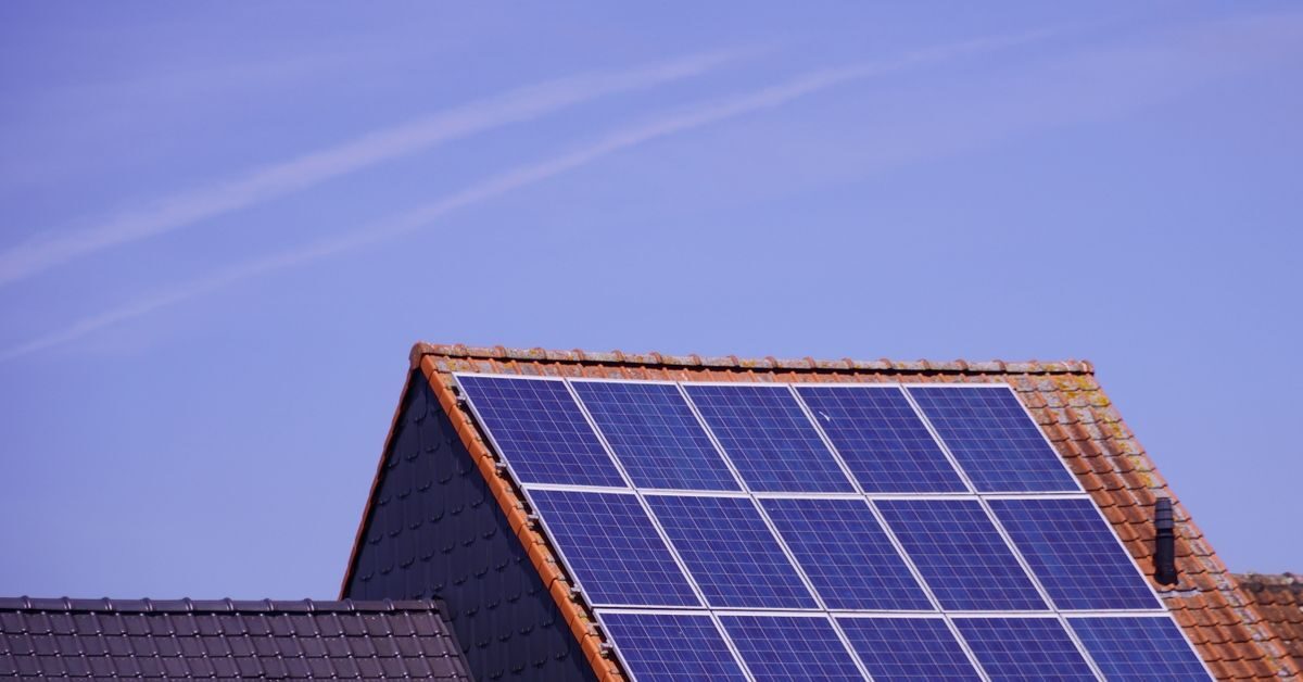 Solar panels on a tiled rooftop showing 2kw solar panel price factors